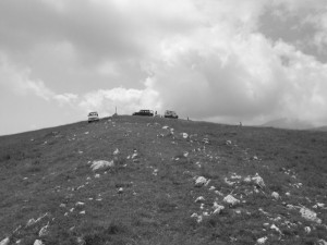 The peak with cross and three jeeps