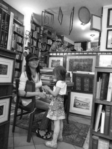 In an antique book shop down a Bassano side street buying a 19th Century print of the Bridge